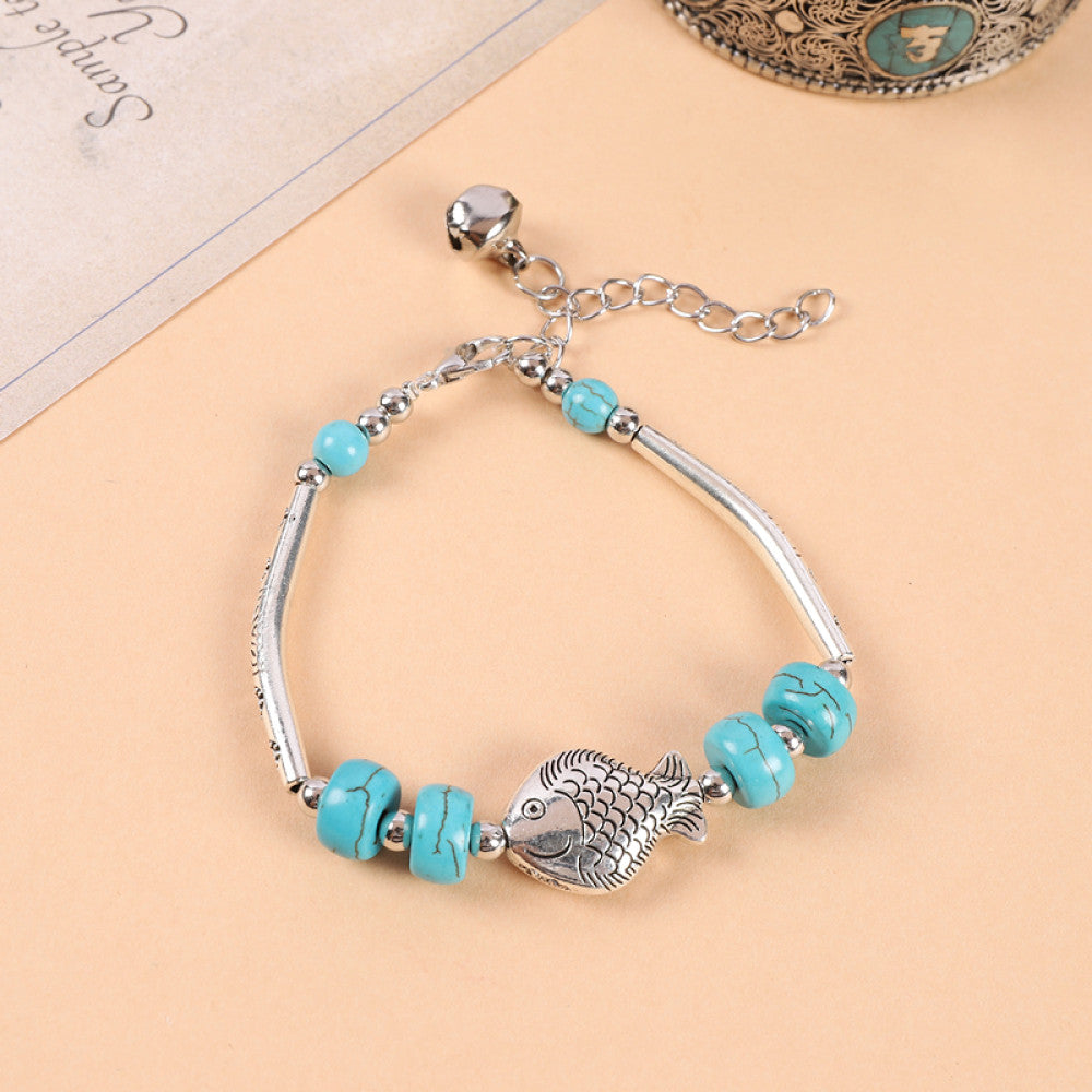 Clustered turquoise beads with silver accents, light and fresh.