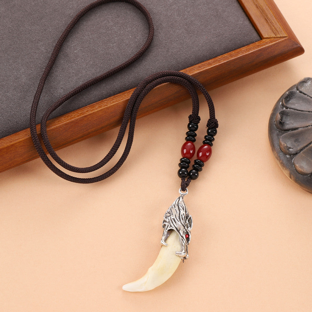 Vintage wolf tooth pendant necklace for men with tribal style metal wolf design and beaded cord 04
