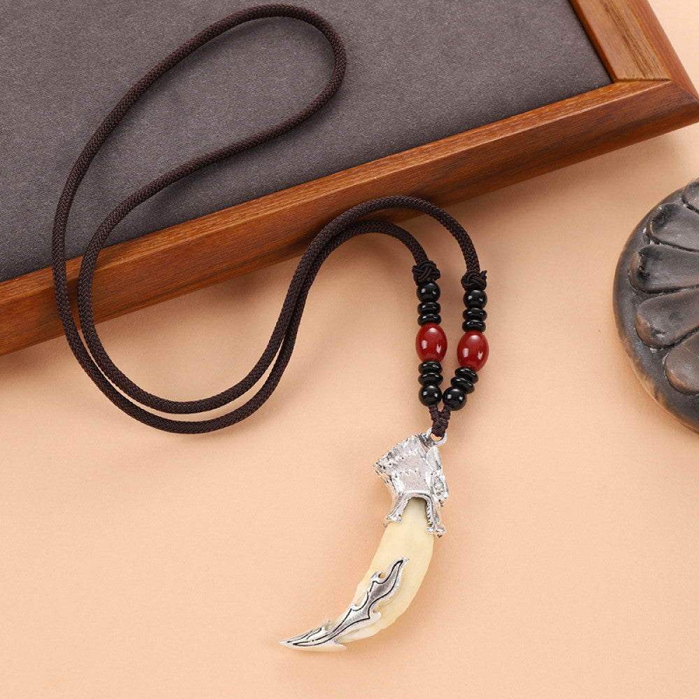 Vintage wolf tooth pendant necklace for men with tribal style metal wolf design and beaded cord