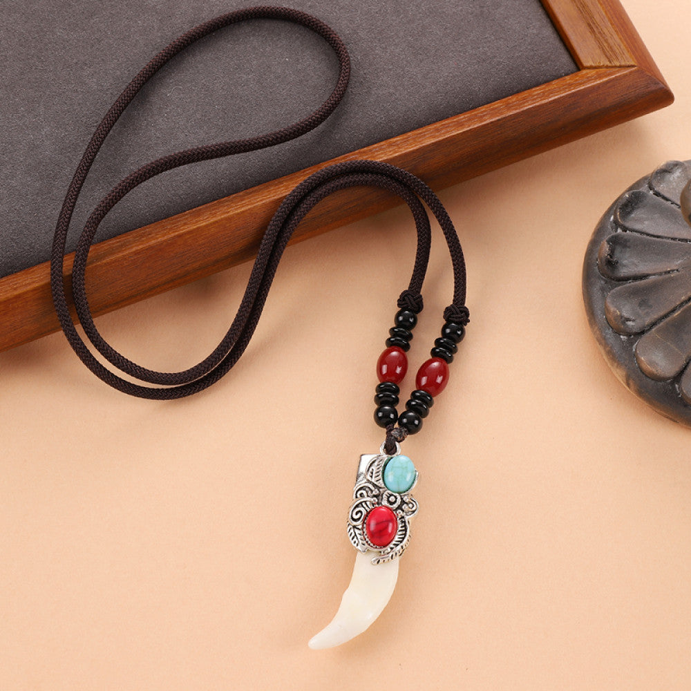 Vintage wolf tooth pendant necklace for men with tribal style metal wolf design and beaded cord 06