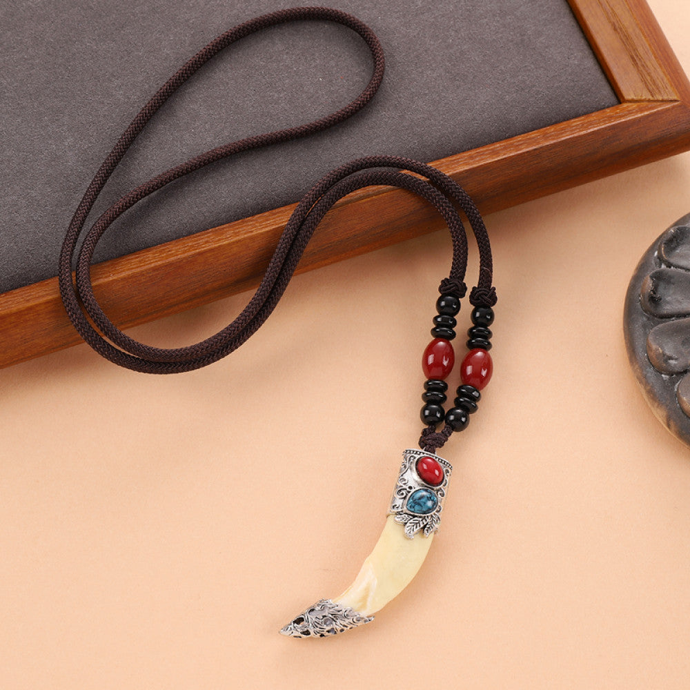 Vintage wolf tooth pendant necklace for men with tribal style metal wolf design and beaded cord 09