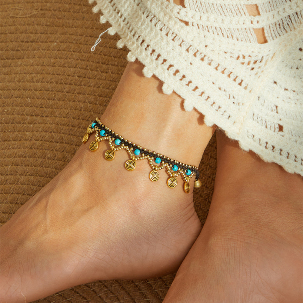 Shows the golden anklet on ankle, ideal for beach and vacation looks