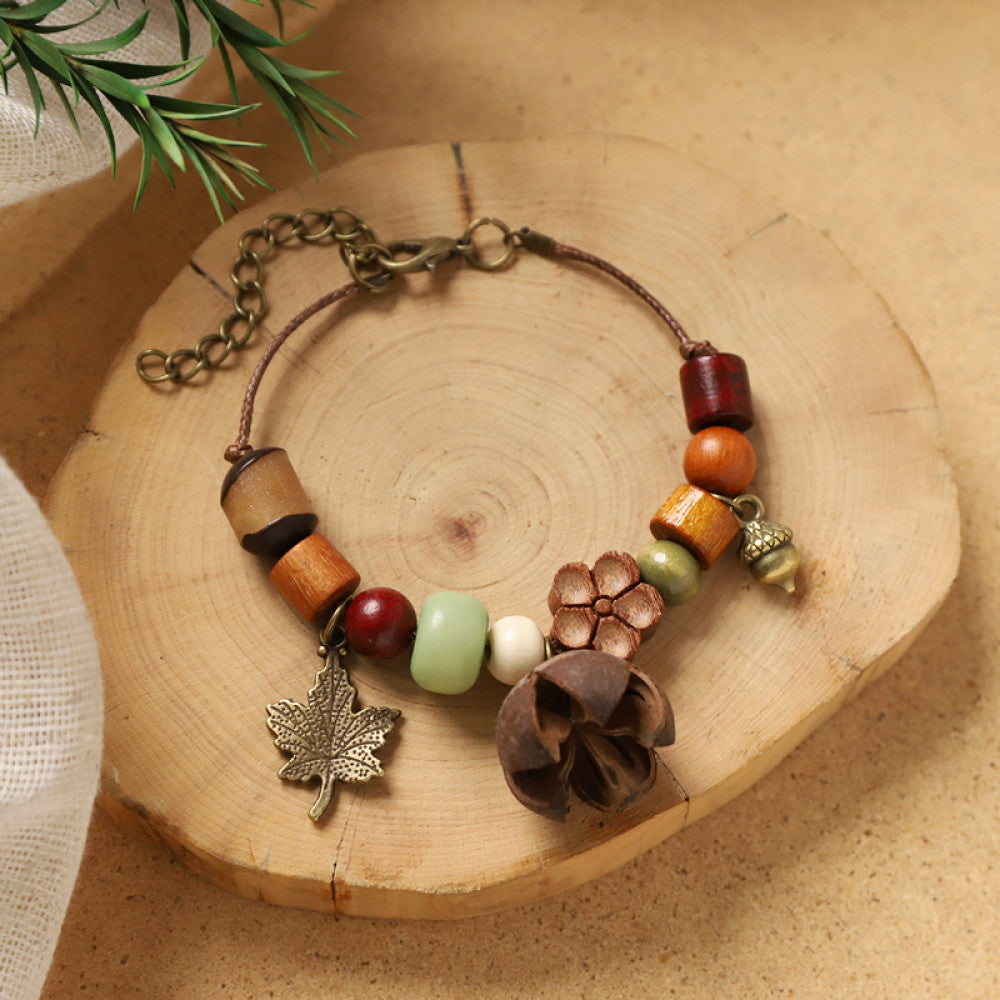 Mixed beads with a thin wood slice charm, clean and natural.