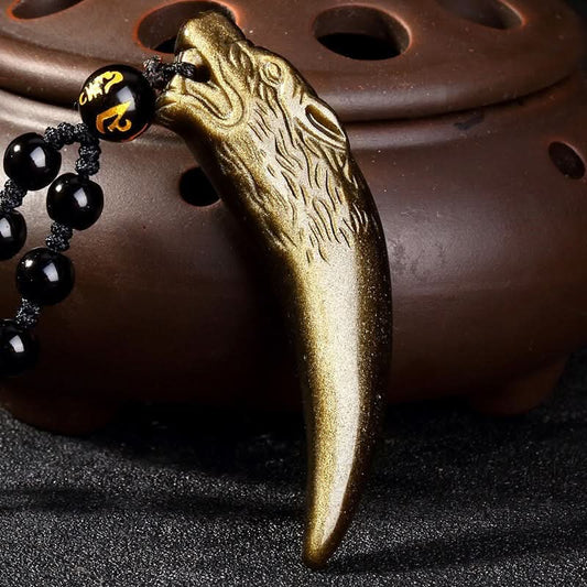 Antique brass wolf tooth pendant with carved head, strung on black bead chain | DIY Jade