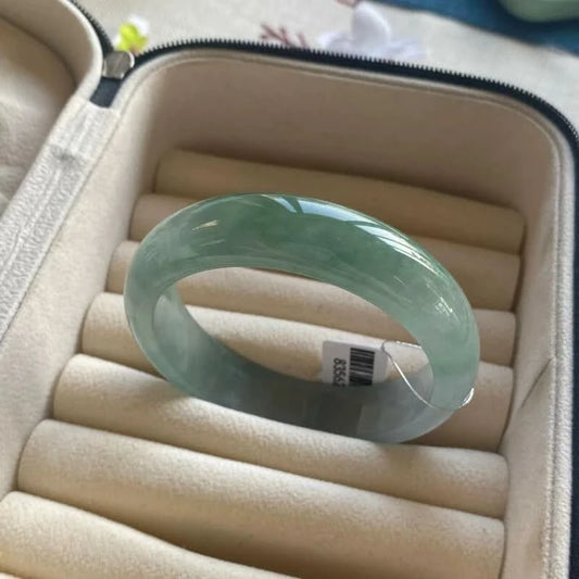 Natural dark green jadeite bangle bracelet with tag, displayed in jewelry storage case | DIY Jade