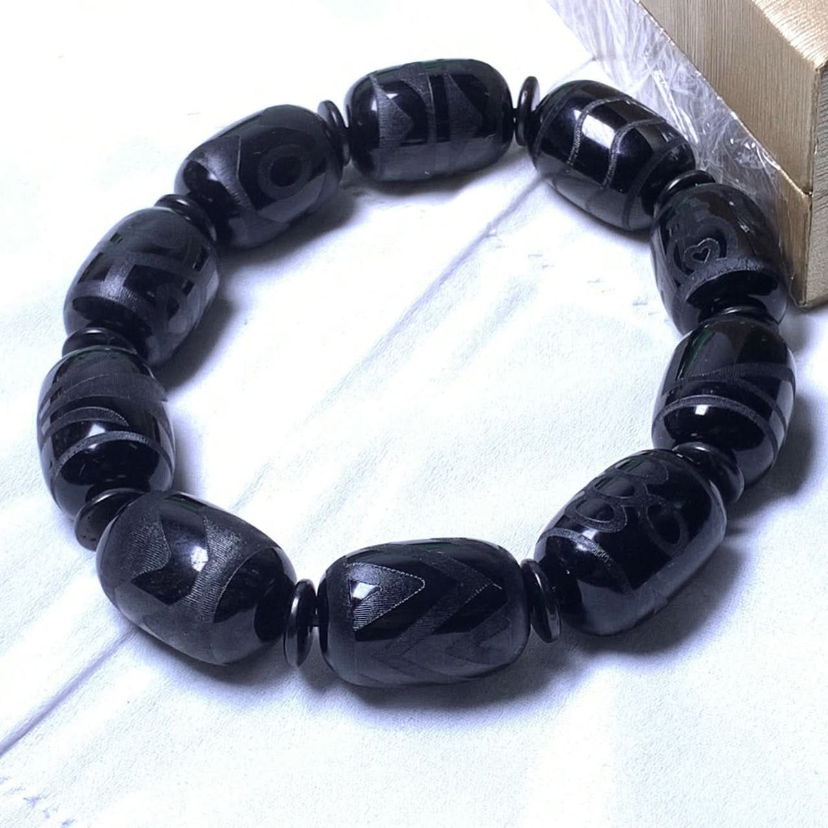 Barrel-shaped black obsidian stretch bracelet, polished natural stone jewelry | DIY Jade