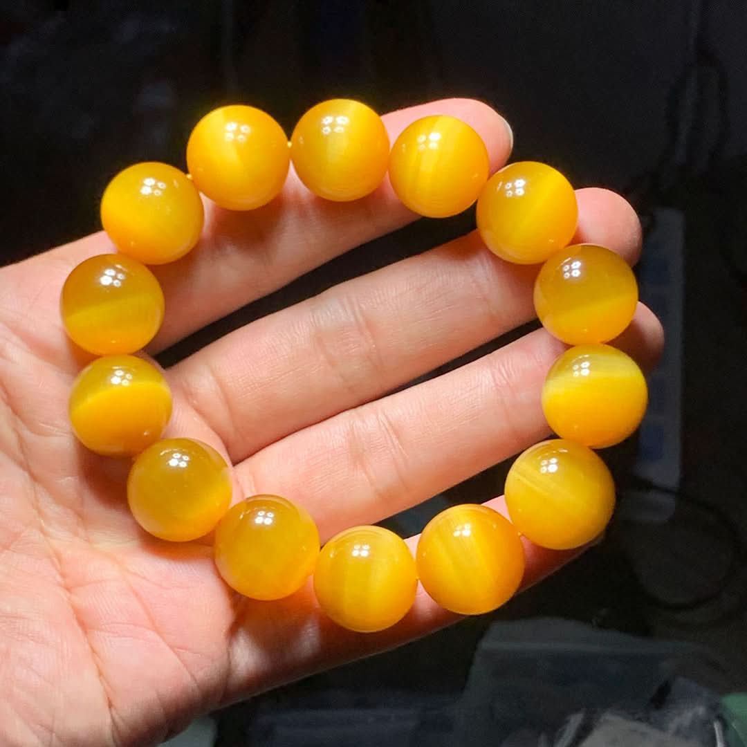 Bright yellow cat's eye round bead bracelet with chatoyant sheen, polished gemstone jewelry | DIY Jade