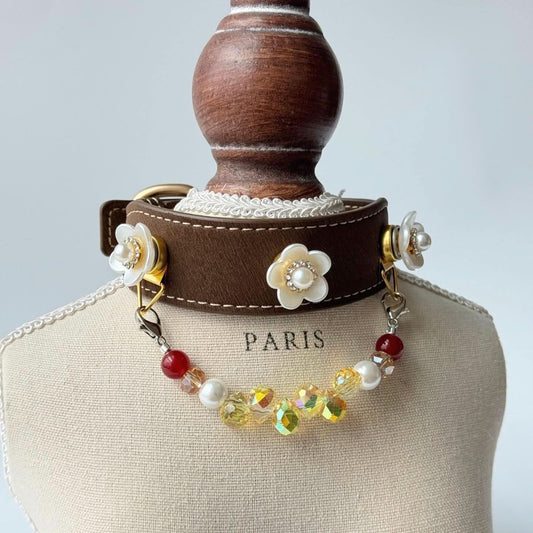 Side view of brown floral pet collar with red crystal beads displayed on dress form bust | DIY Jade