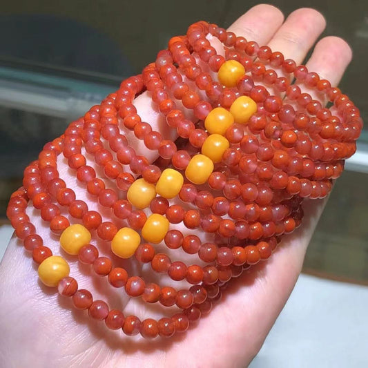Set of red agate bracelets with yellow accent beads, bulk view | DIY Jade