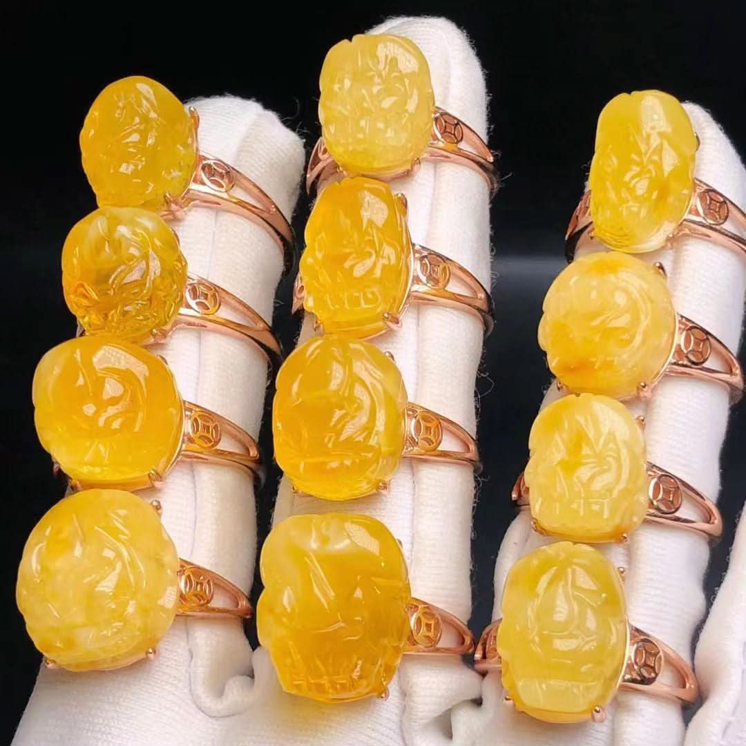 Collection of carved yellow amber rings with rose gold settings | DIY Jade