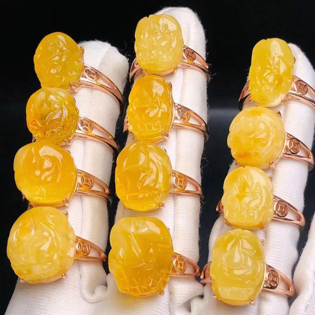 Collection of carved yellow amber rings with rose gold settings | DIY Jade