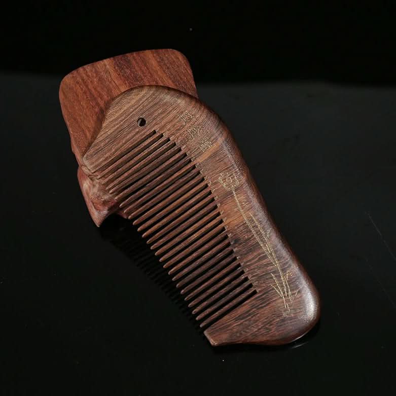 Closeup of engraved wooden hair comb