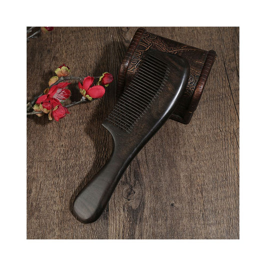 Close up of ebony wood hair comb handle texture