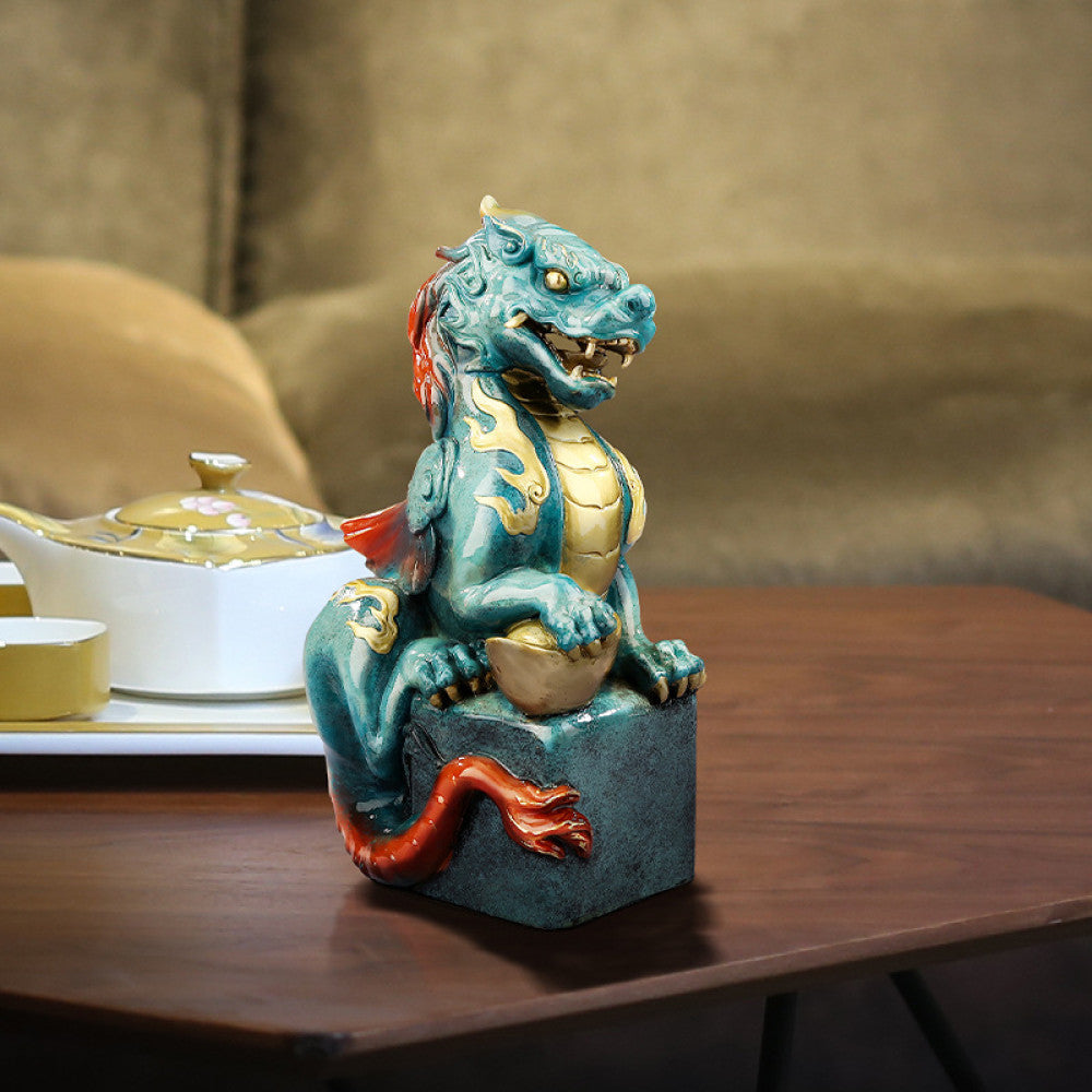Intricate teal and gold Chinese dragon statue, a symbol of power and good fortune in feng shui, placed on a square base against a warm-toned background 01