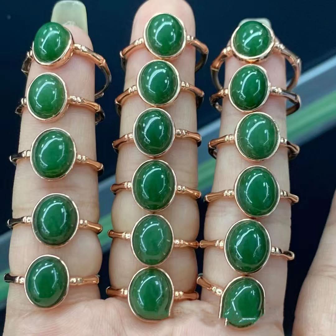 Polished green jade cabochon rings in rose gold settings, bulk display | DIY Jade