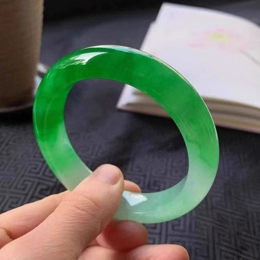 Green to white gradient jade bangle side view, showing glossy smooth surface | DIY Jade