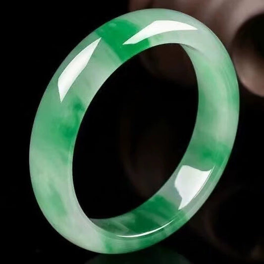 Half green and half white jadeite bangle side view, showing smooth glossy finish | DIY Jade