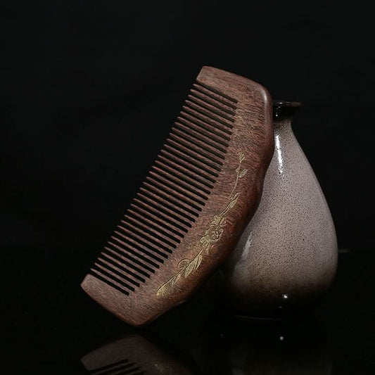 Hand carved wooden hair comb with gold pattern