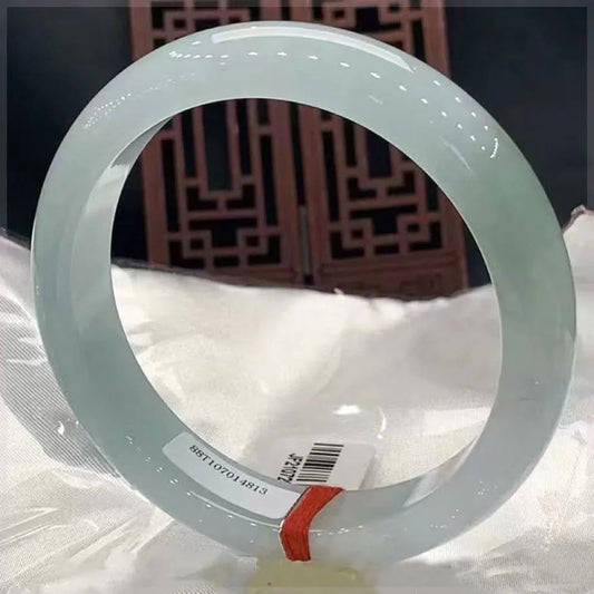 Natural light green floating flower jadeite bangle bracelet, full view on display with tag | DIY Jade