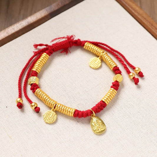 Red string bracelet with stacked gold beads and multiple gold charms | DIY Jade