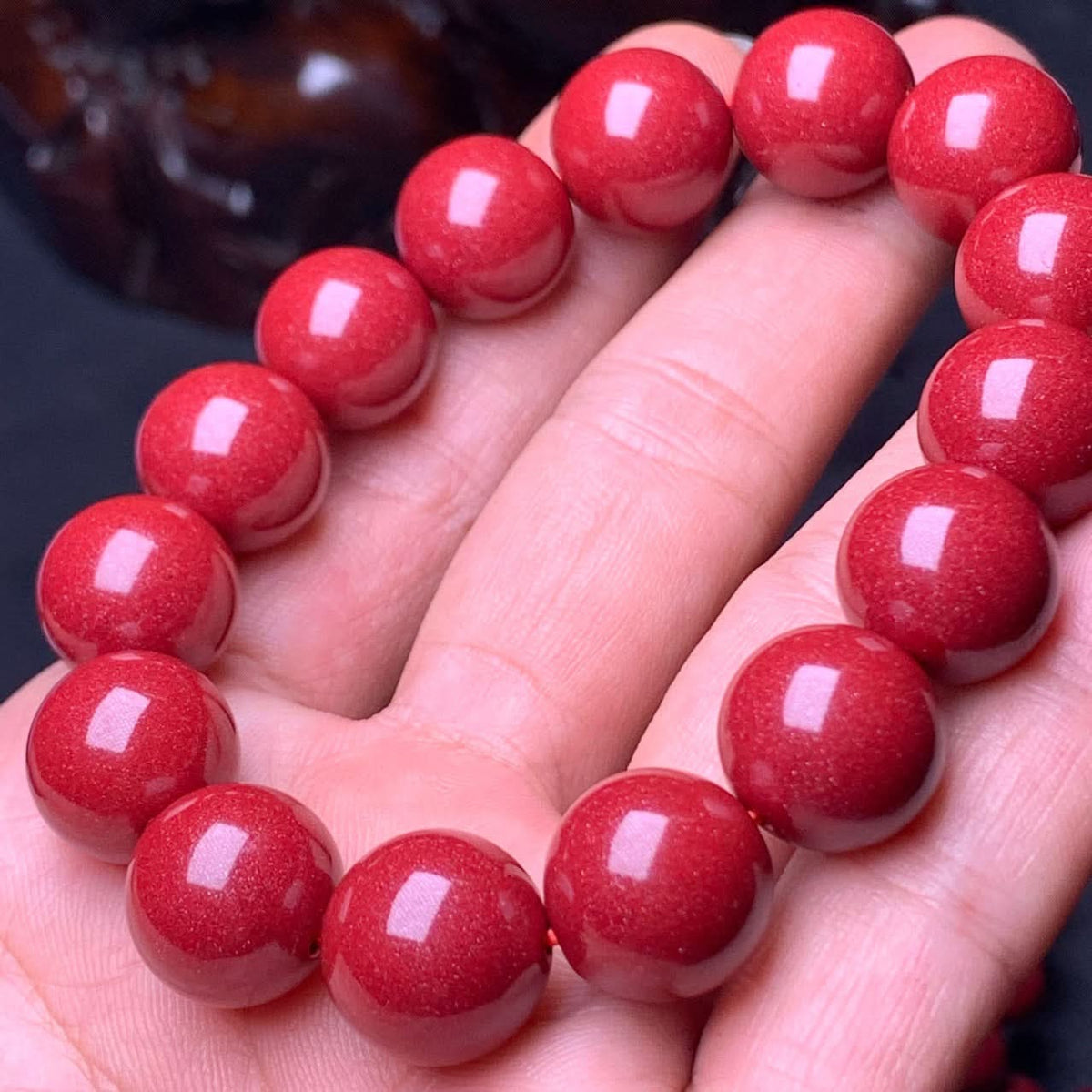 Natural red cinnabar round bead bracelet held in hand, polished high-purity cinnabar gemstone jewelry | DIY Jade