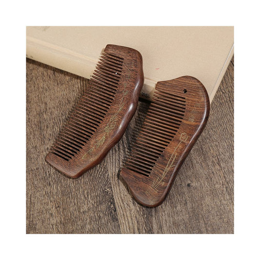 Pair of engraved wooden hair combs