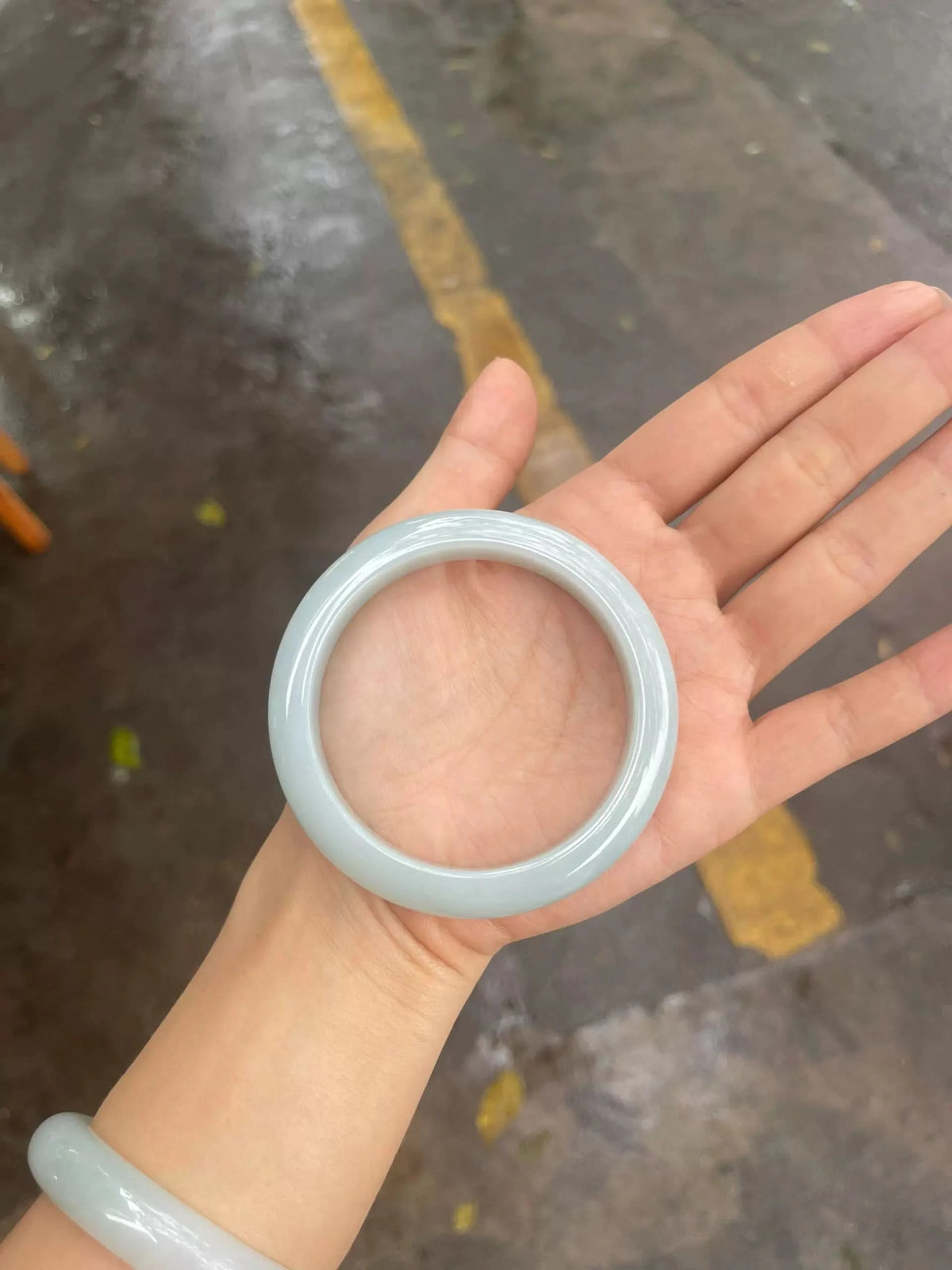 Pale white jadeite bangle bracelet worn on wrist, everyday lifestyle shot | DIY Jade