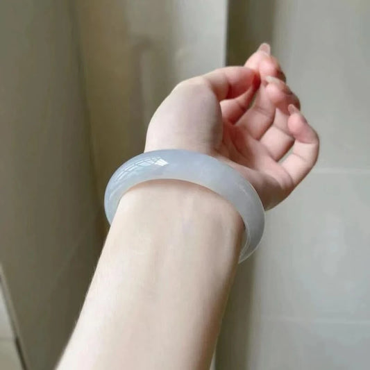 Translucent pale white jade bangle worn on wrist, showing elegant everyday fit | DIY Jade