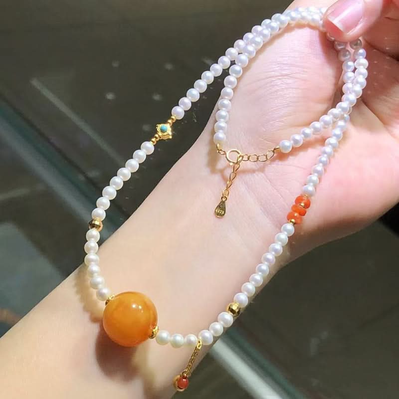 Pearl strand necklace with large amber pendant, red agate and turquoise accents | DIY Jade