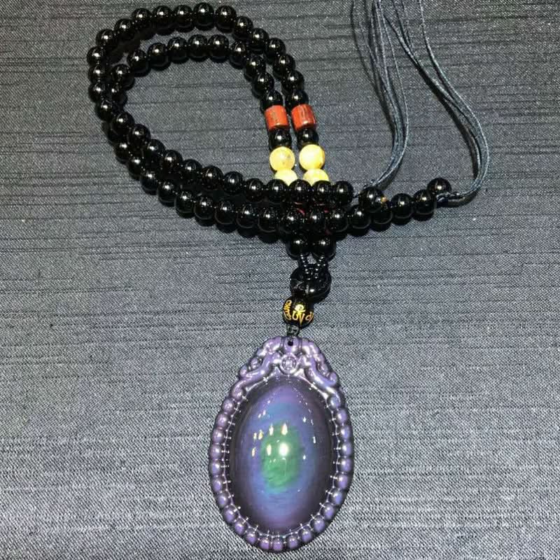 Natural rainbow obsidian teardrop pendant with carved frame and black bead chain | DIY Jade