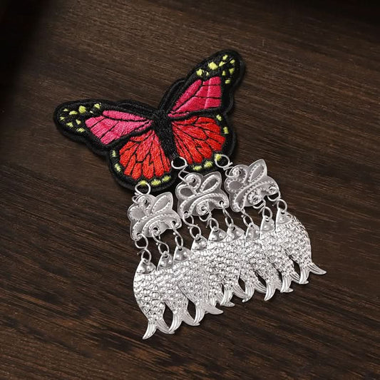 Red butterfly embroidered earrings with silver fish tassels