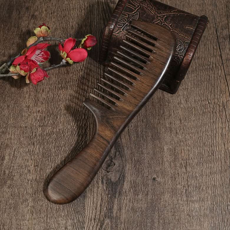 Side view of natural ebony wood hair comb