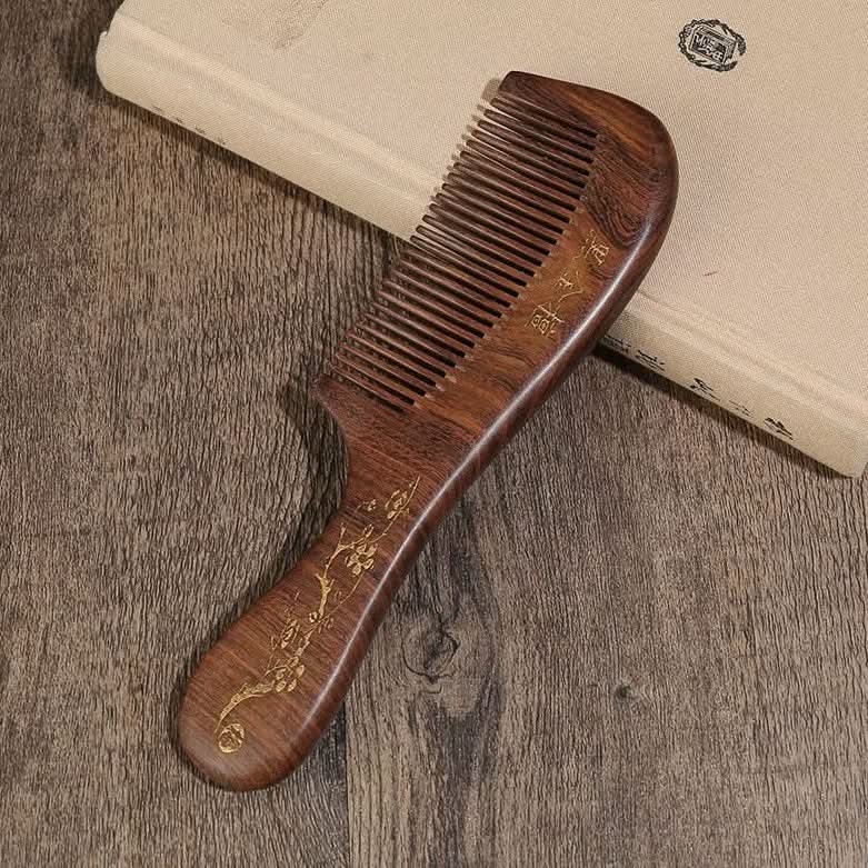 Side view of natural ebony wood hair comb