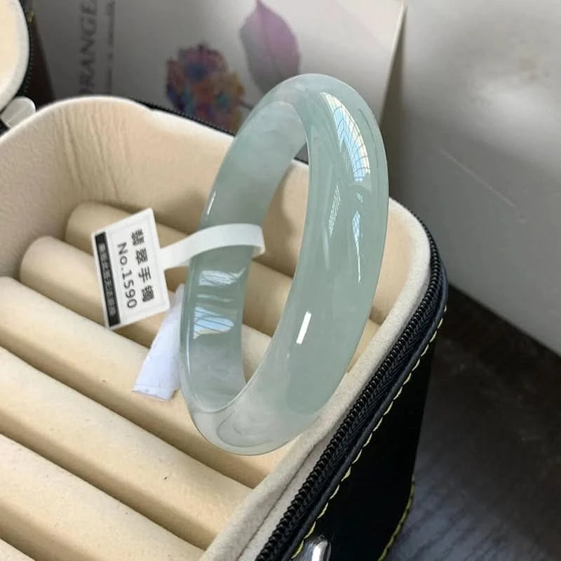 Translucent light green jadeite bangle in jewelry box with tag, elegant storage view | DIY Jade