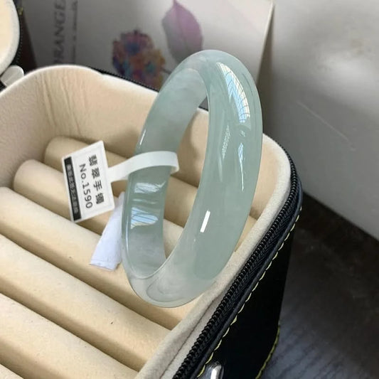 Translucent light green jadeite bangle in jewelry box with tag, elegant storage view | DIY Jade