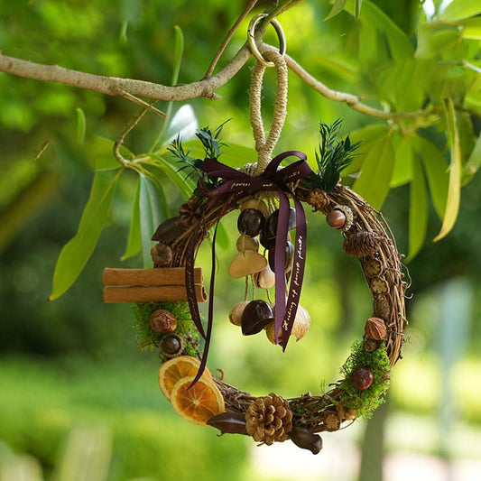 Woven wicker wreath wind chime, natural botanic pieces hanging on tree branch | DIY Jade