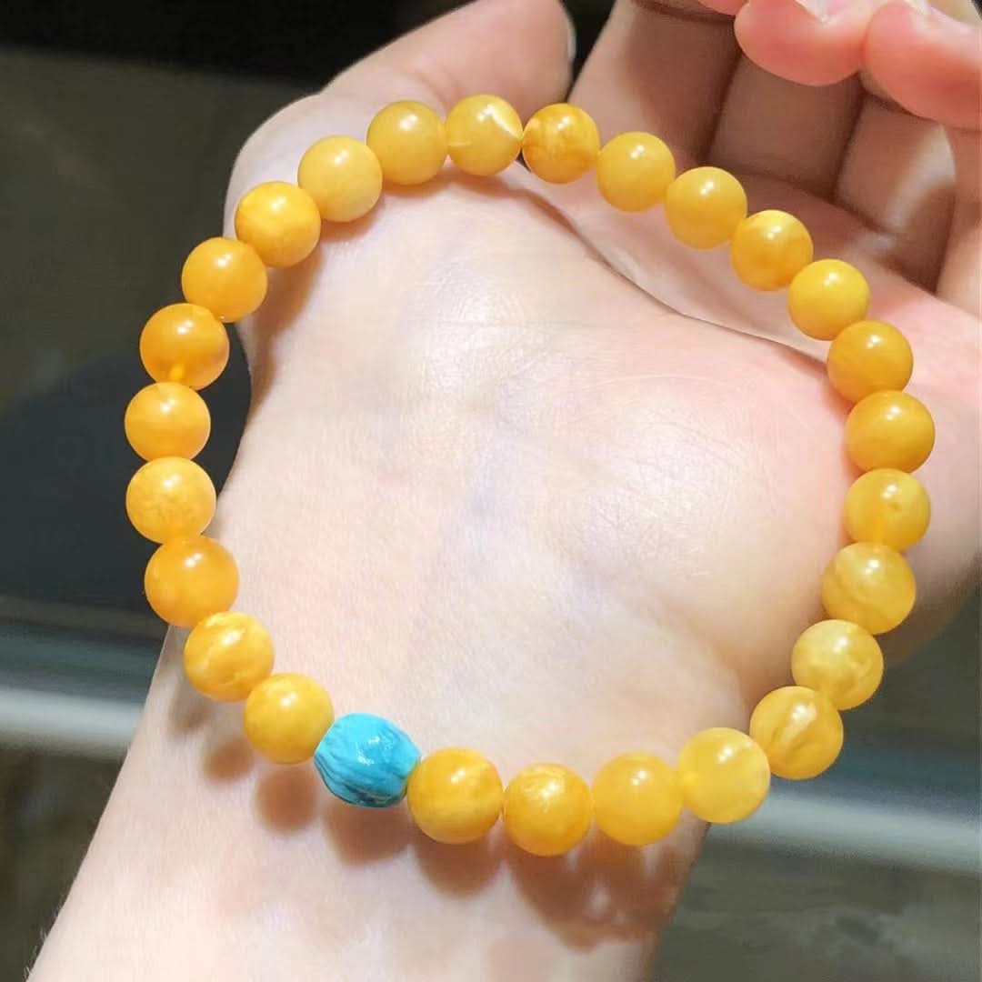 Yellow amber round bead bracelet with single turquoise accent | DIY Jade