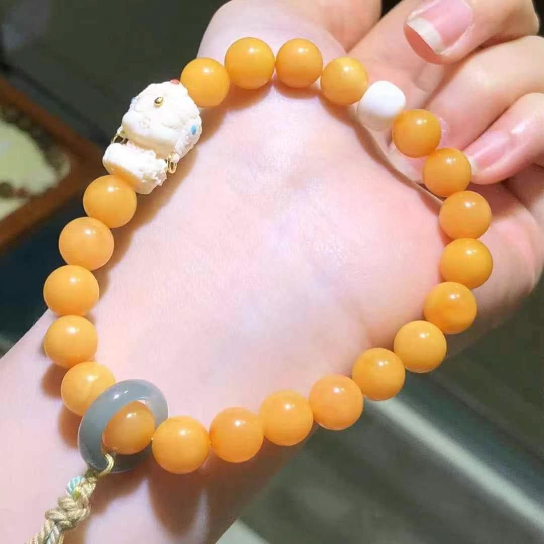 Yellow round bead bracelet with carved white charm and gray jade ring | DIY Jade