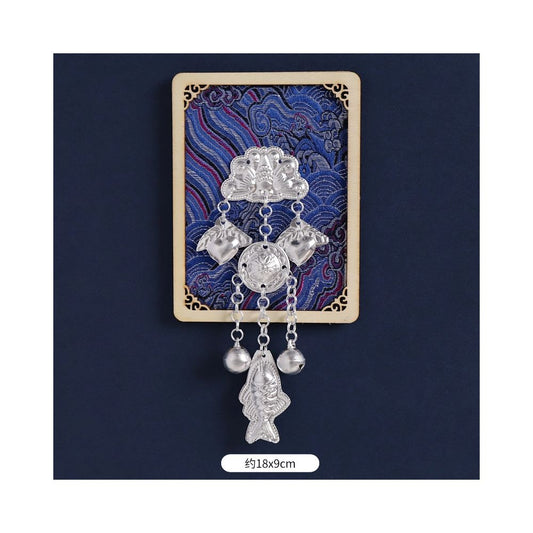 Blue floral refrigerator magnet with silver hanging charms.