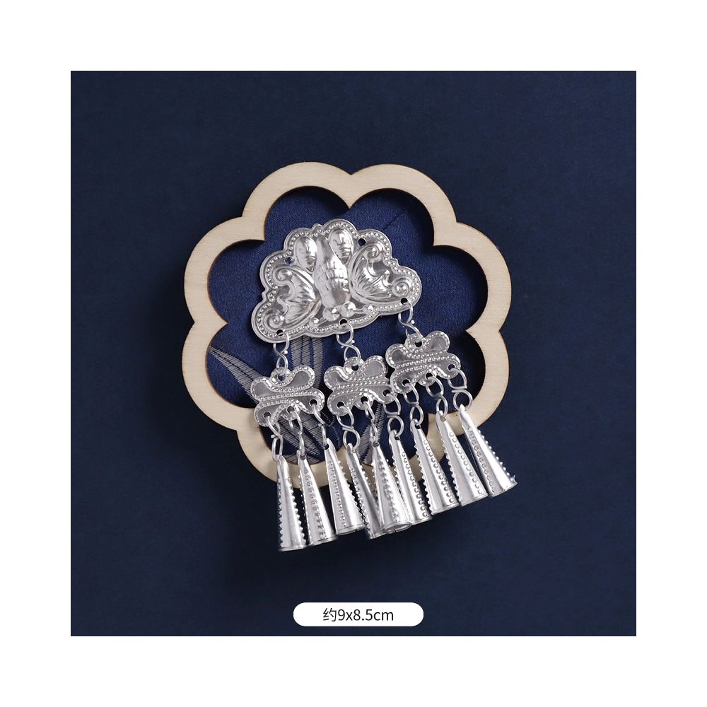 Blue petal-shaped fridge magnet with tassel ornaments.