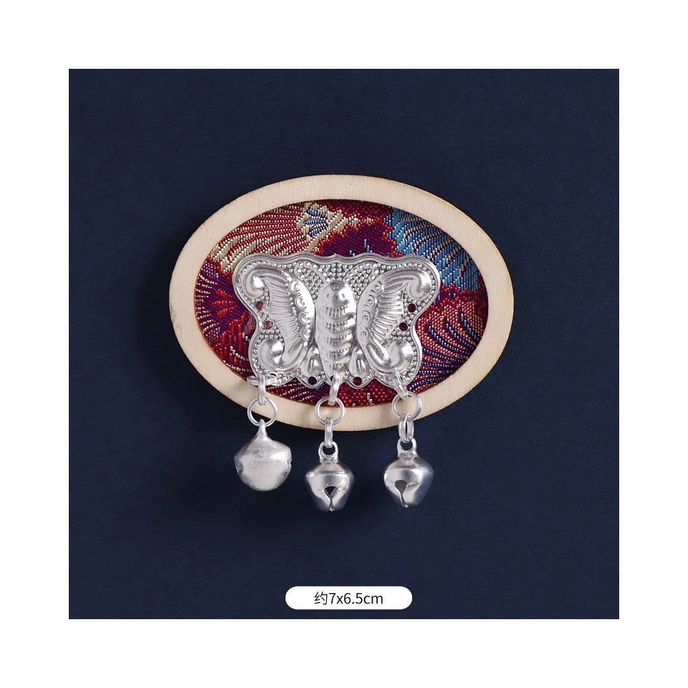 Blue rectangular decorative magnet with tassels.
