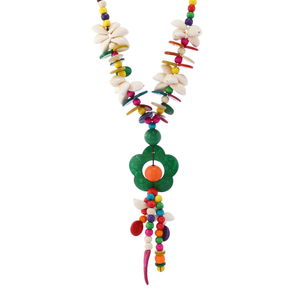 Vintage bohemian colorful shell and beaded necklace with tropical floral pendant, featuring multi-color beads and shell accents, ideal for boho beach and ethnic fashion, displayed on a black mannequin against a dark background 05