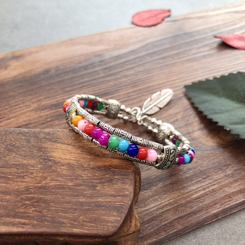 Vintage bohemian ethnic black beaded bracelet with silver engraved accents, displayed on a wooden surface, ideal for boho fashion enthusiasts 02