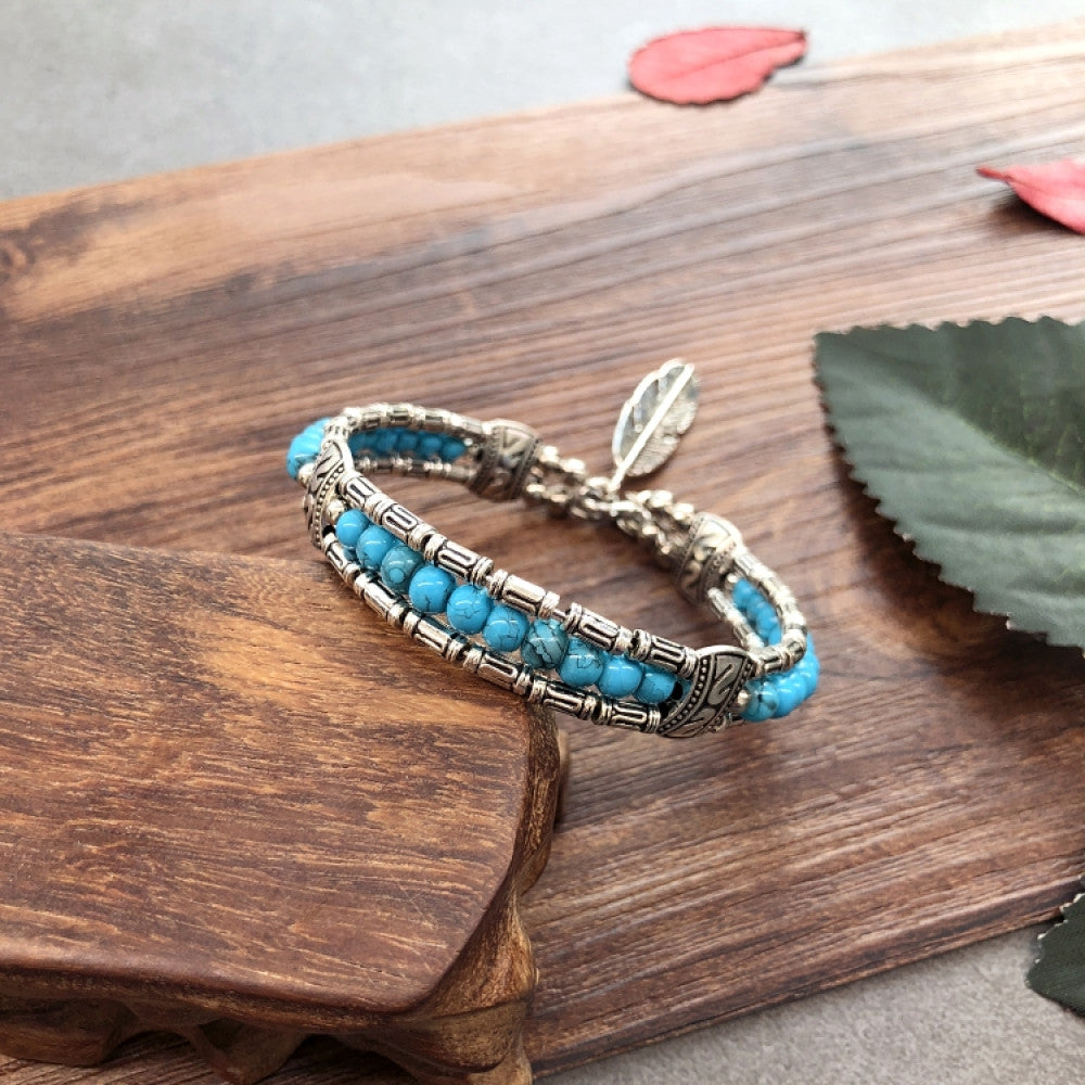 Vintage bohemian ethnic black beaded bracelet with silver engraved accents, displayed on a wooden surface, ideal for boho fashion enthusiasts 05