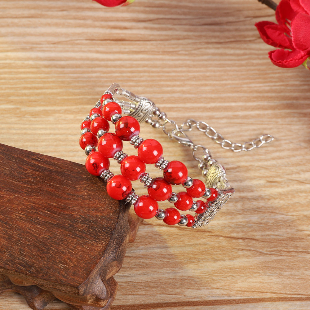 Vintage bohemian ethnic colorful beaded bracelet with multi-color stone beads and silver accents, displayed on a wooden surface, ideal for boho fashion enthusiasts 01