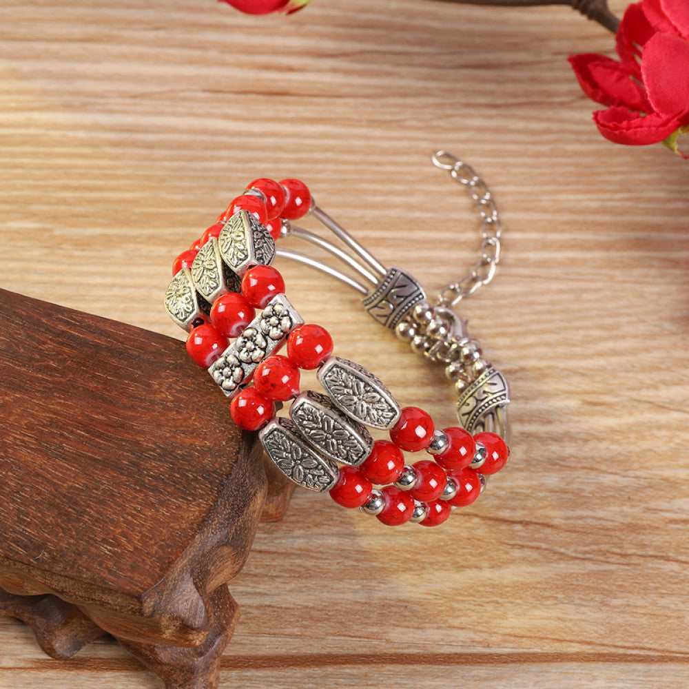 Vintage bohemian ethnic colorful beaded bracelet with multi-color stone beads and silver accents, displayed on a wooden surface, ideal for boho fashion enthusiasts 09