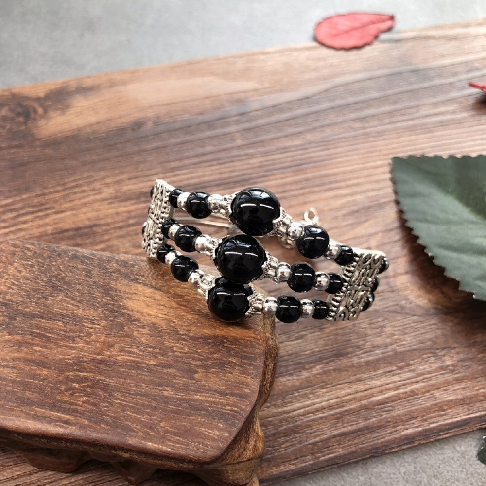 Vintage bohemian ethnic colorful beaded bracelet set with silver fish accents, displayed on a wooden surface, ideal for boho fashion enthusiasts 06