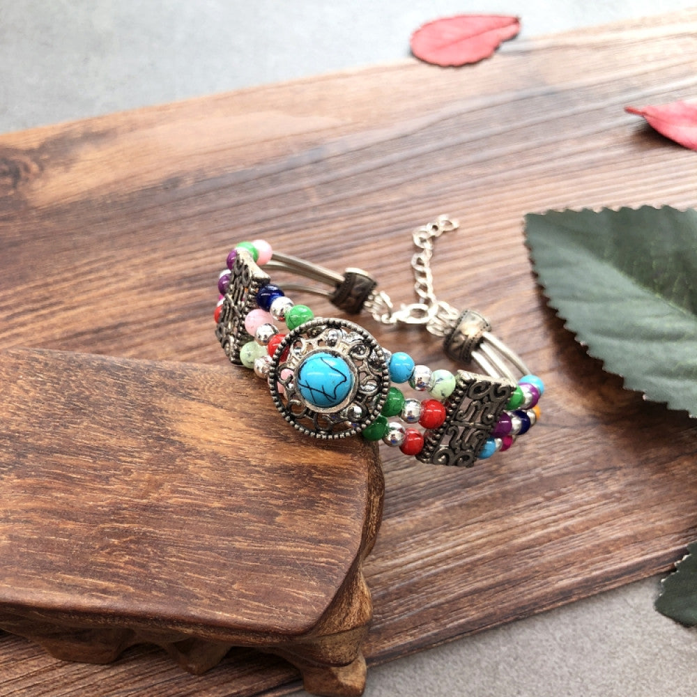 Vintage bohemian ethnic colorful beaded bracelet set with silver fish accents, displayed on a wooden surface, ideal for boho fashion enthusiasts 08