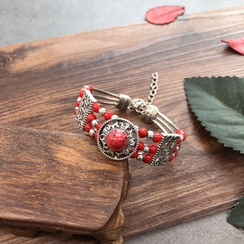 Vintage bohemian ethnic colorful beaded bracelet set with silver fish accents, displayed on a wooden surface, ideal for boho fashion enthusiasts 09
