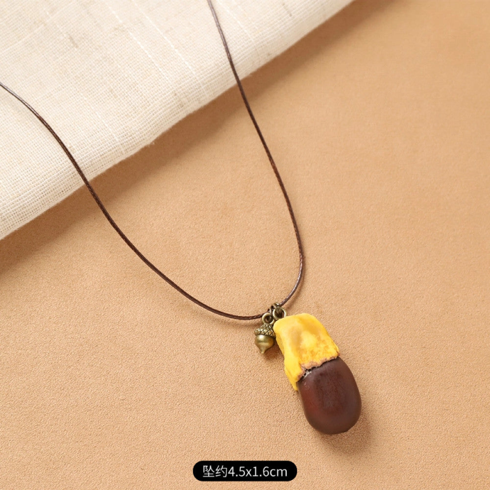 Vintage bohemian ethnic necklace with round natural stone pendant, featuring earthy brown tones and cord design, displayed on a neutral background with linen accent, ideal for boho fashion enthusiasts 05